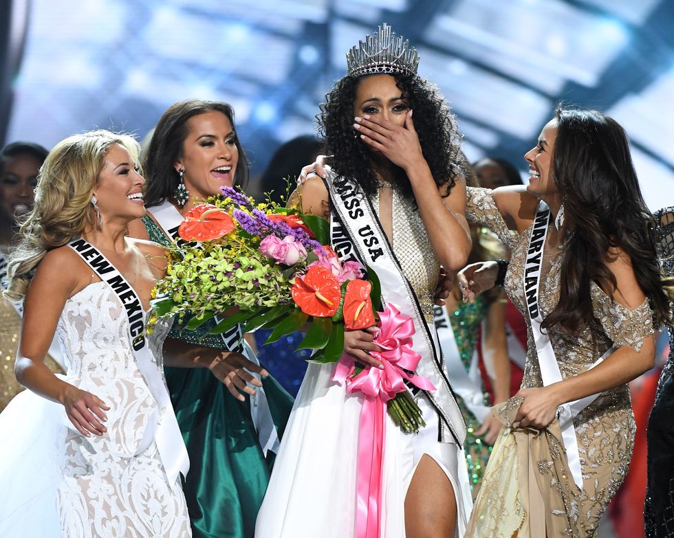 LAS VEGAS, NV - MAY 14:  Miss District of Columbia USA 2017 Kara McCullough (3rd L) is surrounded by fellow contestants after she was crowned Miss USA 2017 during the 2017 Miss USA pageant at the Mandalay Bay Events Center on May 14, 2017 in Las Vegas, Nevada.  (Photo by Ethan Miller/Getty Images)