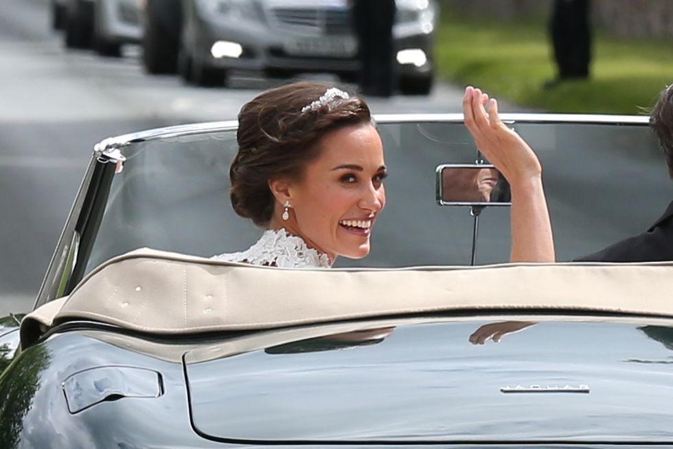 ENGLEFIELD GREEN, ENGLAND - MAY 20:  Bride Pippa Middleton and her new husband James Matthews (not seen) leave St Mark's Church in a classic car after their Wedding Ceremony on May 20, 2017 in Englefield, England.  (Photo by Neil Mockford/GC Images)