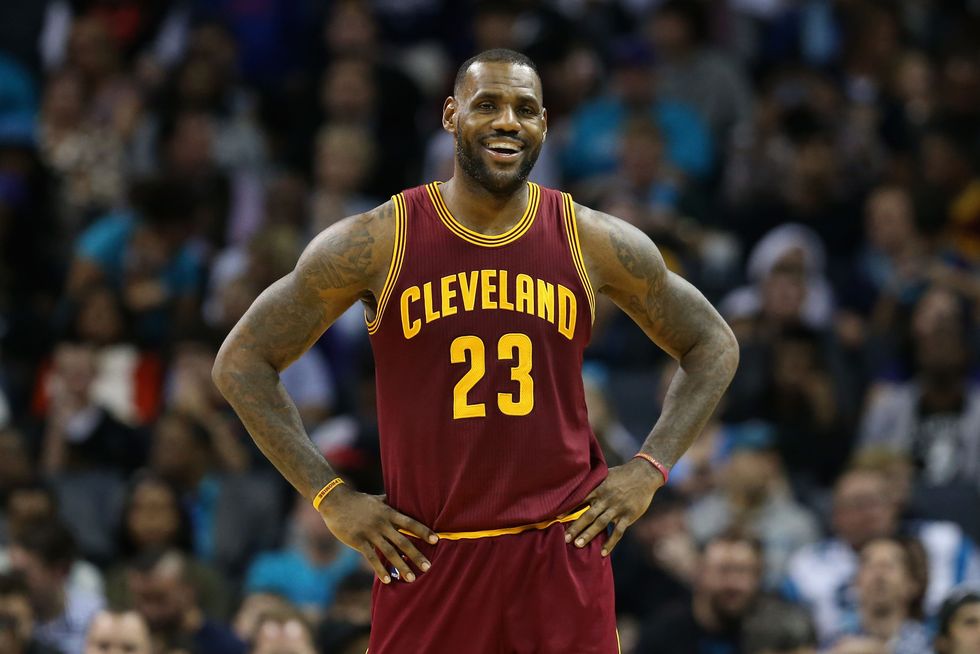 CHARLOTTE, NC - NOVEMBER 27:  LeBron James #23 of the Cleveland Cavaliers reacts during their game against the Charlotte Hornets at Time Warner Cable Arena on November 27, 2015 in Charlotte, North Carolina.  NBA - NOTE TO USER: User expressly acknowledges and agrees that, by downloading and or using this photograph, User is consenting to the terms and conditions of the Getty Images License Agreement.  (Photo by Streeter Lecka/Getty Images)