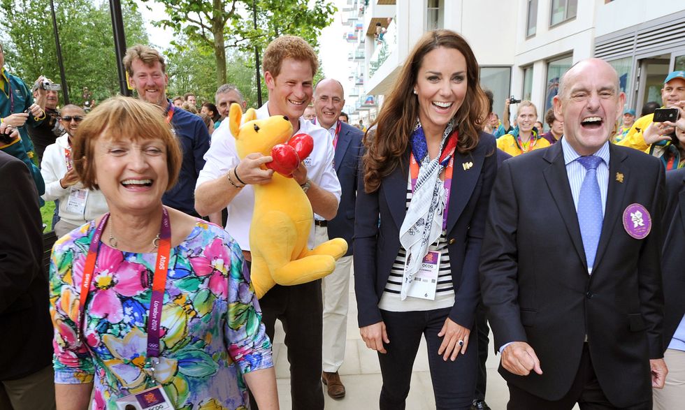 LONDON, ENGLAND - JULY 31:  Prince Harry holds a Kangaroo given to him by Australian athletes as he walks with Catherine, Duchess of Cambridge, MP Tessa Jowell (L) and Mayor of the Olympic Village Sir Charles Allen (R) during a visit to the Team GB accommodation flats in the Athletes Village at the Olympic Park in Stratford on Day 4 of the London 2012 Olympic Games on July 31, 2012 in London, England.  (Photo by John Stillwell - WPA Pool/Getty Images)