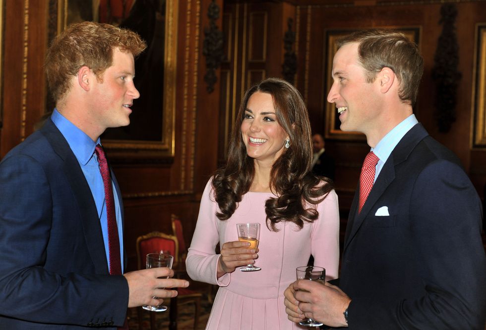 WINDSOR, UNITED KINGDOM - MAY 18:  Prince William, Duke of Cambridge, Catherine, Duchess of Cambridge and Prince Harry chat  during a pre luncheon reception for Sovereign Monarchs and guests in celebration of Queen Elizabeth's Diamond Jubilee at Windsor Castle on May 18, 2012 in Windsor, England. (Photo by Rota/Anwar Hussein/Getty Images)