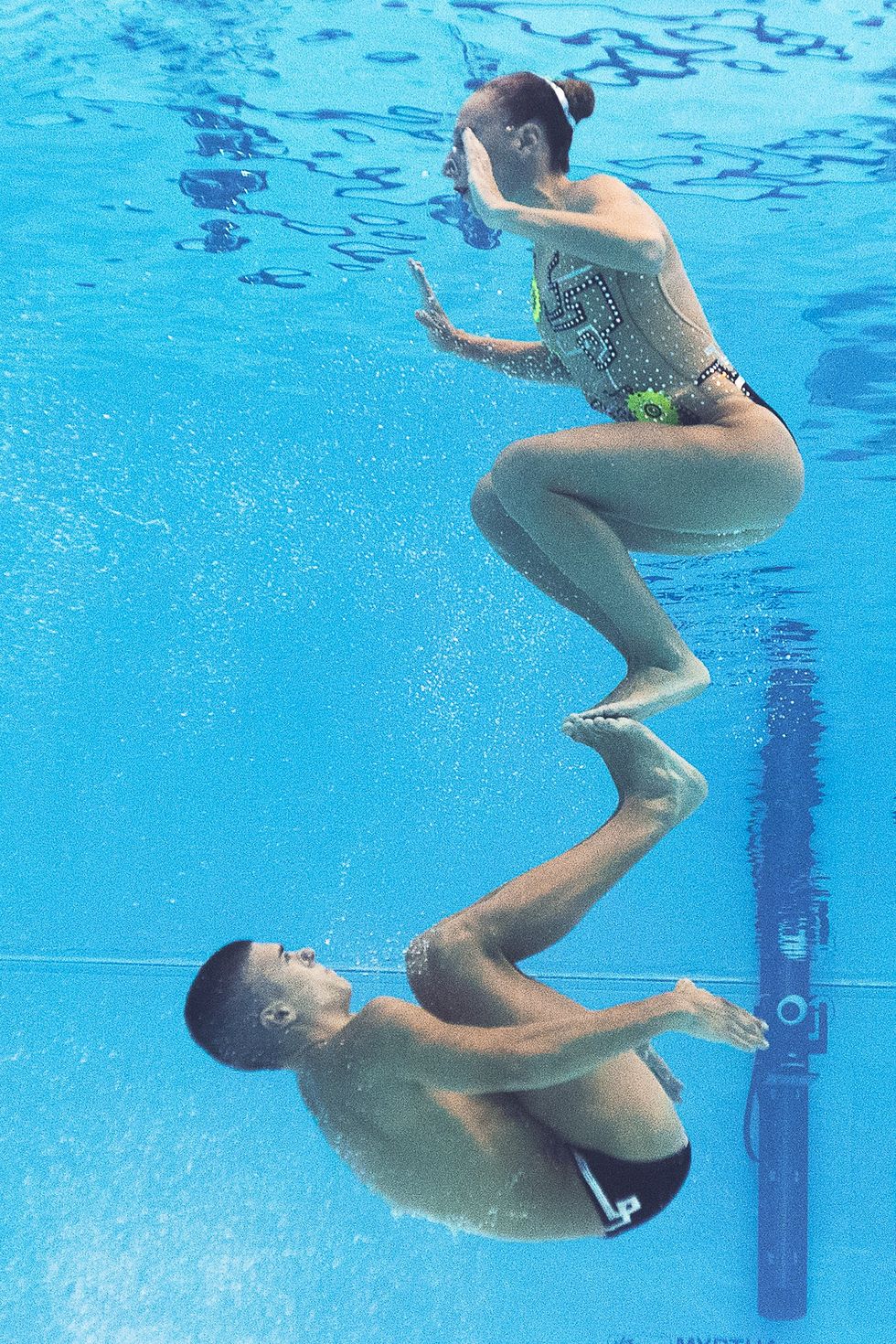 A picture taken with an underwater camera shows Italy's mixed duet Manila Flamini and Giorgio Minisini competing in the Mixed Duet Technical preliminary during the synchronised swimming competition at the 2015 FINA World Championships in Kazan on July 25, 2015.  competes in the Mixed Duet Technical preliminary during the synchronised swimming competition at the 2015 FINA World Championships in Kazan on July 25, 2015.  AFP PHOTO / FRANCOIS XAVIER MARIT        (Photo credit should read FRANCOIS XAVIER MARIT/AFP/Getty Images)