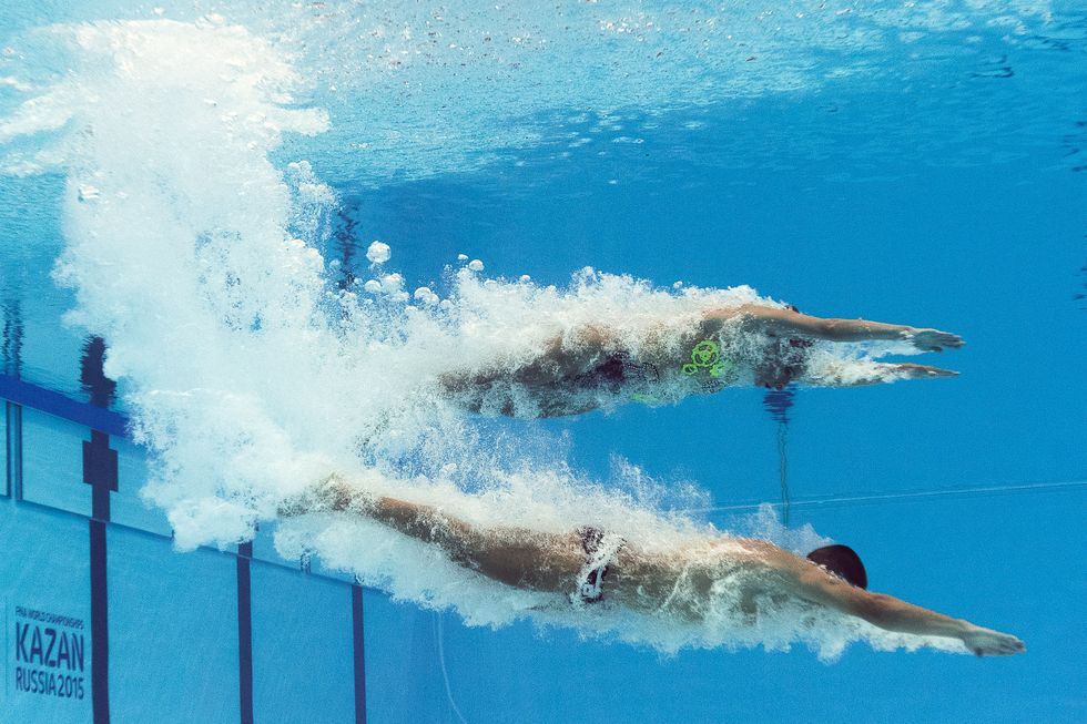 A picture taken with an underwater camera shows Italy's mixed duet Manila Flamini and Giorgio Minisini competing in the Mixed Duet Technical preliminary during the synchronised swimming competition at the 2015 FINA World Championships in Kazan on July 25, 2015.  competes in the Mixed Duet Technical preliminary during the synchronised swimming competition at the 2015 FINA World Championships in Kazan on July 25, 2015.  AFP PHOTO / FRANCOIS XAVIER MARIT        (Photo credit should read FRANCOIS XAVIER MARIT/AFP/Getty Images)