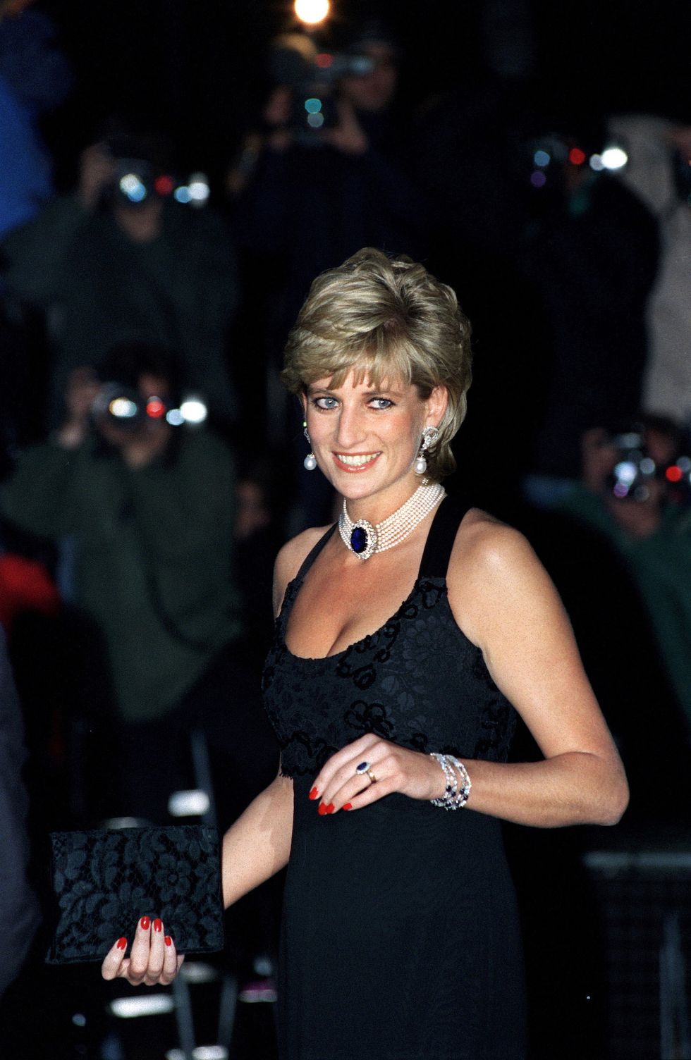 LONDON, UNITED KINGDOM - NOVEMBER 20:  Diana, Princess Of Wales,  Attending A Gala Evening In Aid Of Cancer Research At Bridgewater House, London Sw1.  The Princess Is Wearing A Black Low-cut Evening Dress Designed By Jacques Azagury With An Embroidered Bodice Studded With Sequins.  (Photo by Tim Graham/Getty Images)