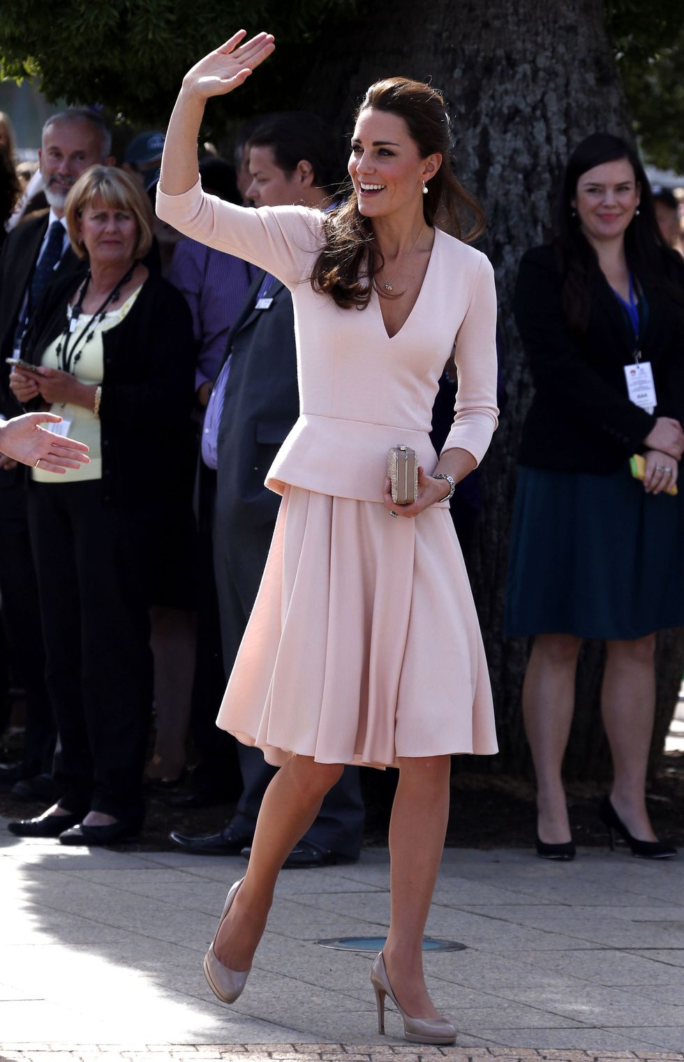 ADELAIDE, AUSTRALIA - APRIL 23:  Catherine, Duchess of Cambridge waves to members of the crowd as she arrives with her husband Prince William, Duke of Cambridge, at the Playford Civic Centre in the Adelaide suburb of Elizabeth on April 23, 2014 in Adelaide, Australia. The Duke and Duchess of Cambridge are on a three-week tour of Australia and New Zealand, the first official trip overseas with their son, Prince George of Cambridge.  (Photo by David Gray - Pool/Getty Images)