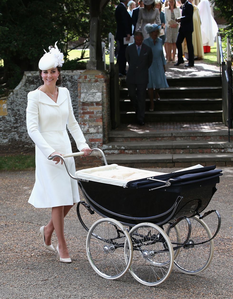 KING'S LYNN, ENGLAND - JULY 05:  Catherine, Duchess of Cambridge pushes  Princess Charlotte of Cambridge in her pram they leave the Church of St Mary Magdalene on the Sandringham Estate for the Christening of Princess Charlotte of Cambridge on July 5, 2015 in King's Lynn, England.  (Photo by Chris Jackson/Getty Images)
