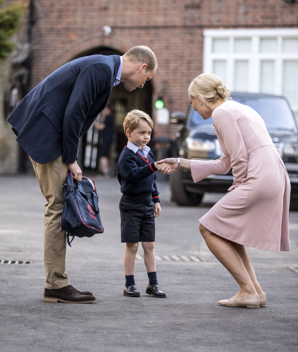LONDON, ENGLAND - SEPTEMBER 7: Prince George of Cambridge arrives for his first day of school with his father Prince William, Duke of Cambridge as they are met Head of the lower school Helen Haslem at Thomas's Battersea on September 7, 2017 in London, England. (Photo by Richard Pohle - WPA Pool/Getty Images)