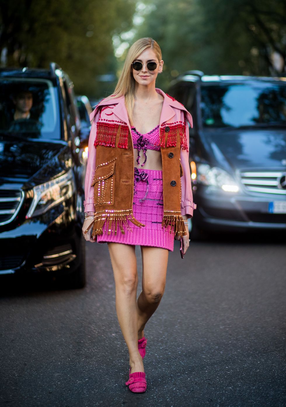 MILAN, ITALY - SEPTEMBER 21: Chiara Ferragni wearing pink skirt and top, jacket with fringes is seen outside Prada during Milan Fashion Week Spring/Summer 2018 on September 21, 2017 in Milan, Italy. (Photo by Christian Vierig/Getty Images)