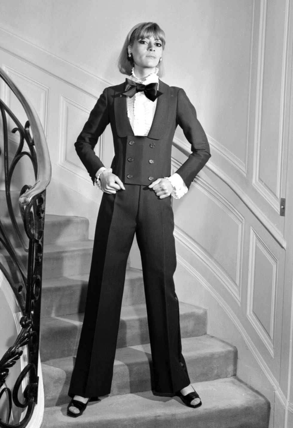 Suit, Formal wear, Clothing, Tuxedo, Standing, Black-and-white, Pantsuit, Outerwear, Photography, Photo shoot, 