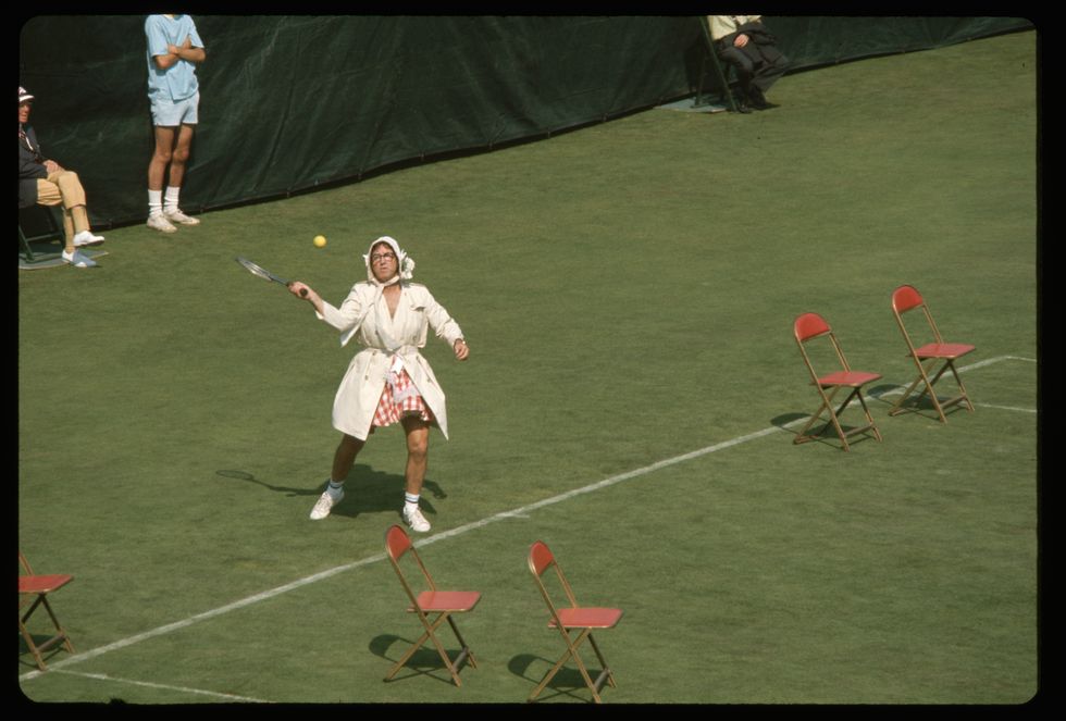 Tennis player Bobby Riggs dresses a woman for his match against Billie Jean King. Male chauvinist Riggs challenged King to the match as a 