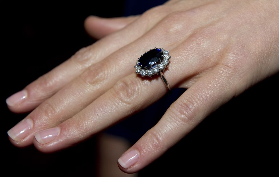 LONDON, ENGLAND - NOVEMBER 16:  A close up of Kate Middleton's engagement ring as she poses for photographs in the State Apartments with her fiance Prince William of St James Palace on November 16, 2010 in London, England. After much speculation, Clarence House today announced the engagement of Prince William to Kate Middleton. The couple will get married in either the Spring or Summer of next year and continue to live in North Wales while Prince William works as an air sea rescue pilot for the RAF. The couple became engaged during a recent holiday in Kenya having been together for eight years.  (Photo by Arthur Edwards - WPA Pool/Getty Images)