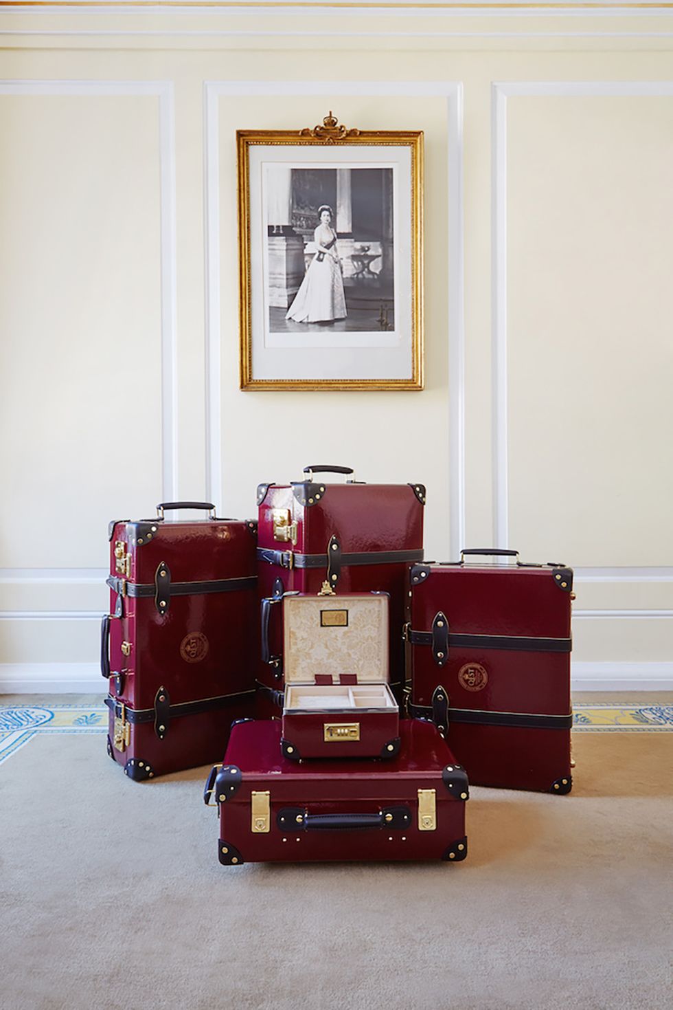 Red, Room, Floor, Flooring, Luggage and bags, Baggage, Maroon, Picture frame, Cabinetry, Suitcase, 
