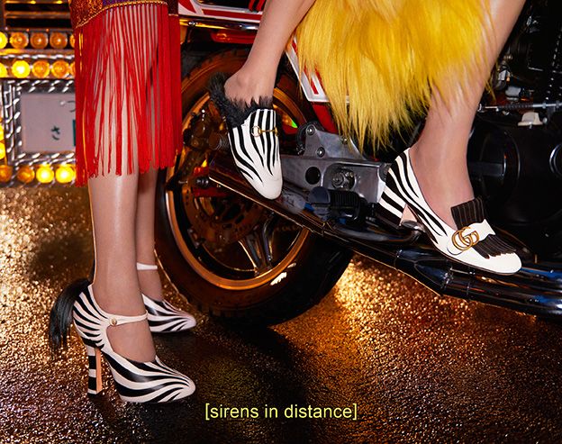 Human leg, Motorcycle accessories, Sandal, Calf, Foot, Bag, High heels, Motorcycle, Ankle, 