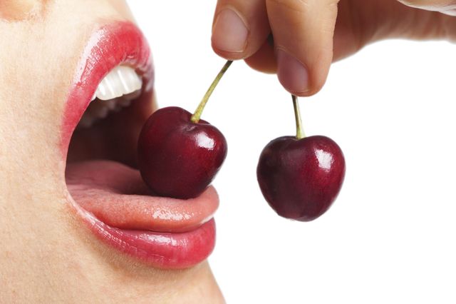 Lip, Finger, Skin, Cherry, Red, Fruit, Tooth, Natural foods, Produce, Organ, 
