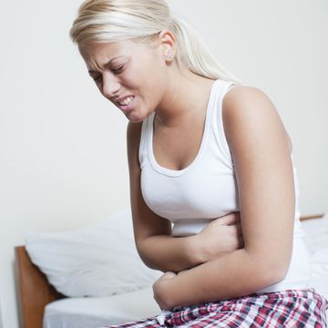 a woman on her period feeling stomach ache