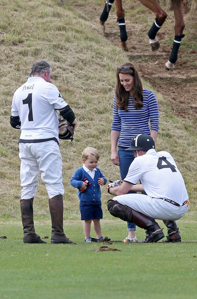 Prince William talking to his son Prince George