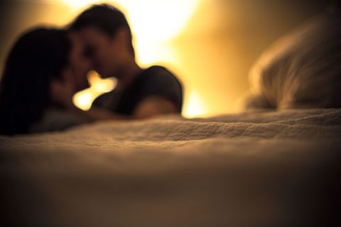 couple making out in the bed