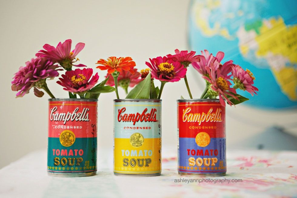 Reusing tin cans as decoration.