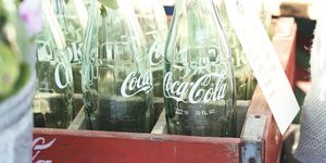 Coca-cola, Cola, Drink, Glass bottle, Carbonated soft drinks, Bottle, Soft drink, Coca, Glass, Plant, 