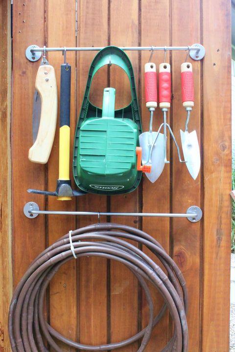 Wood, Cable, Hardwood, Wire, Wood stain, Handle, Hose, Circle, Strap, Electrical supply, 
