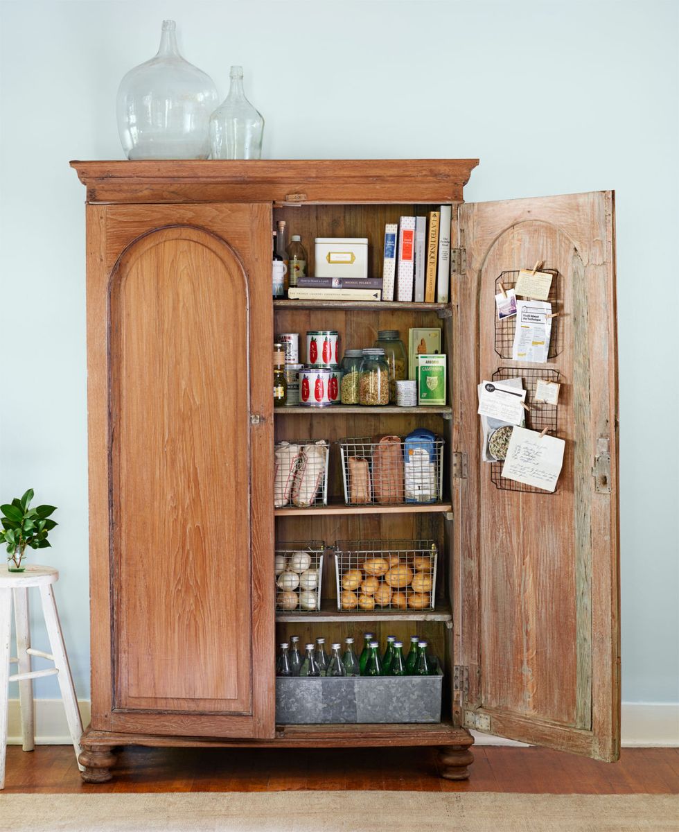 Victorian period organised pantry interior with old antique storage  stoneware jars