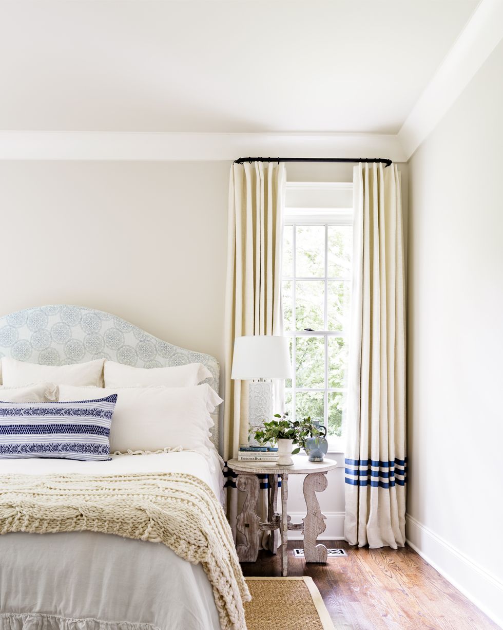 a pretty neutral bedroom with touches of blue