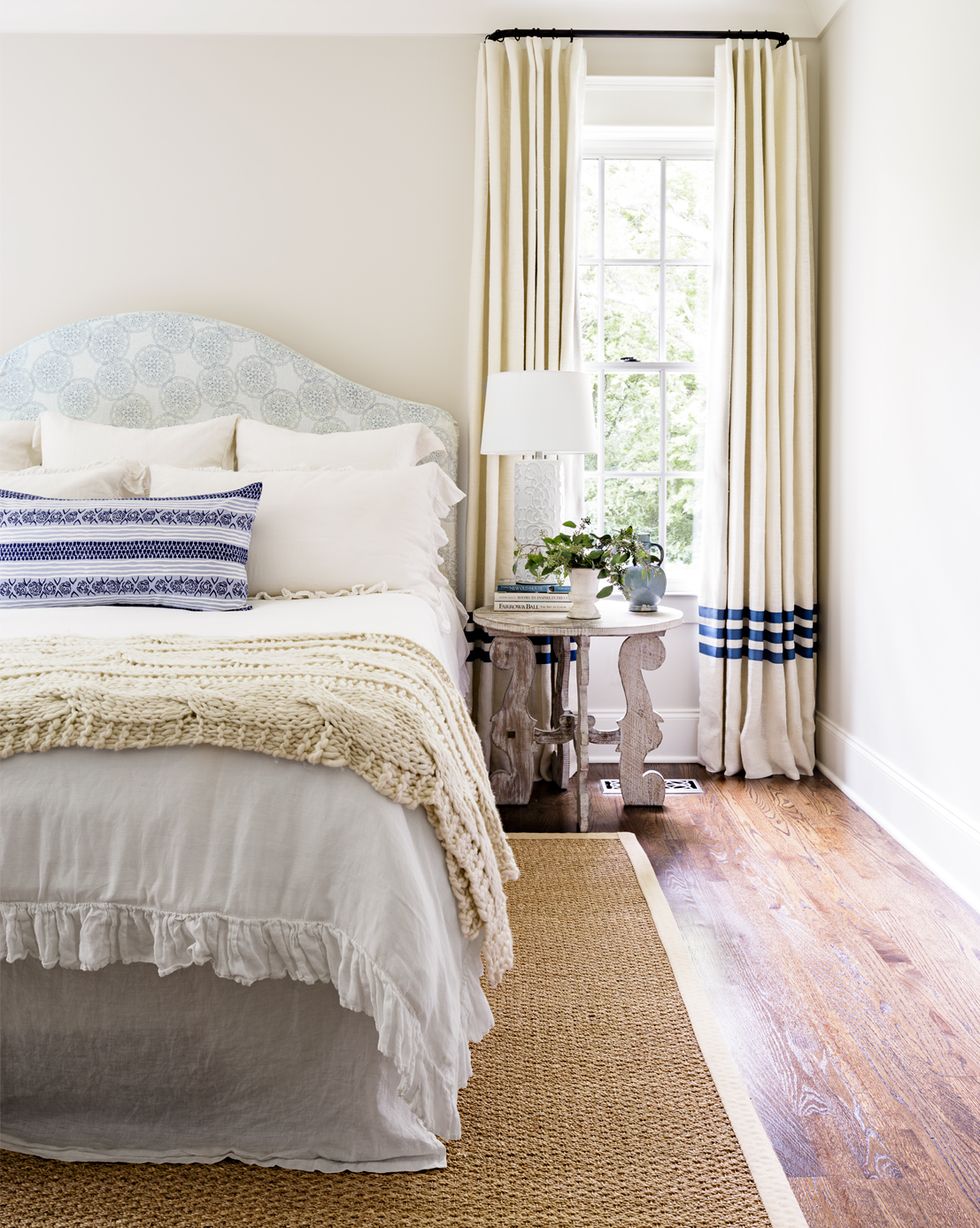 a pretty neutral bedroom with touches of blue