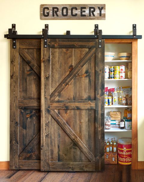Wood, Hardwood, Door, Wood stain, Home door, Fixture, Door handle, Handle, Wood flooring, Shelf, 