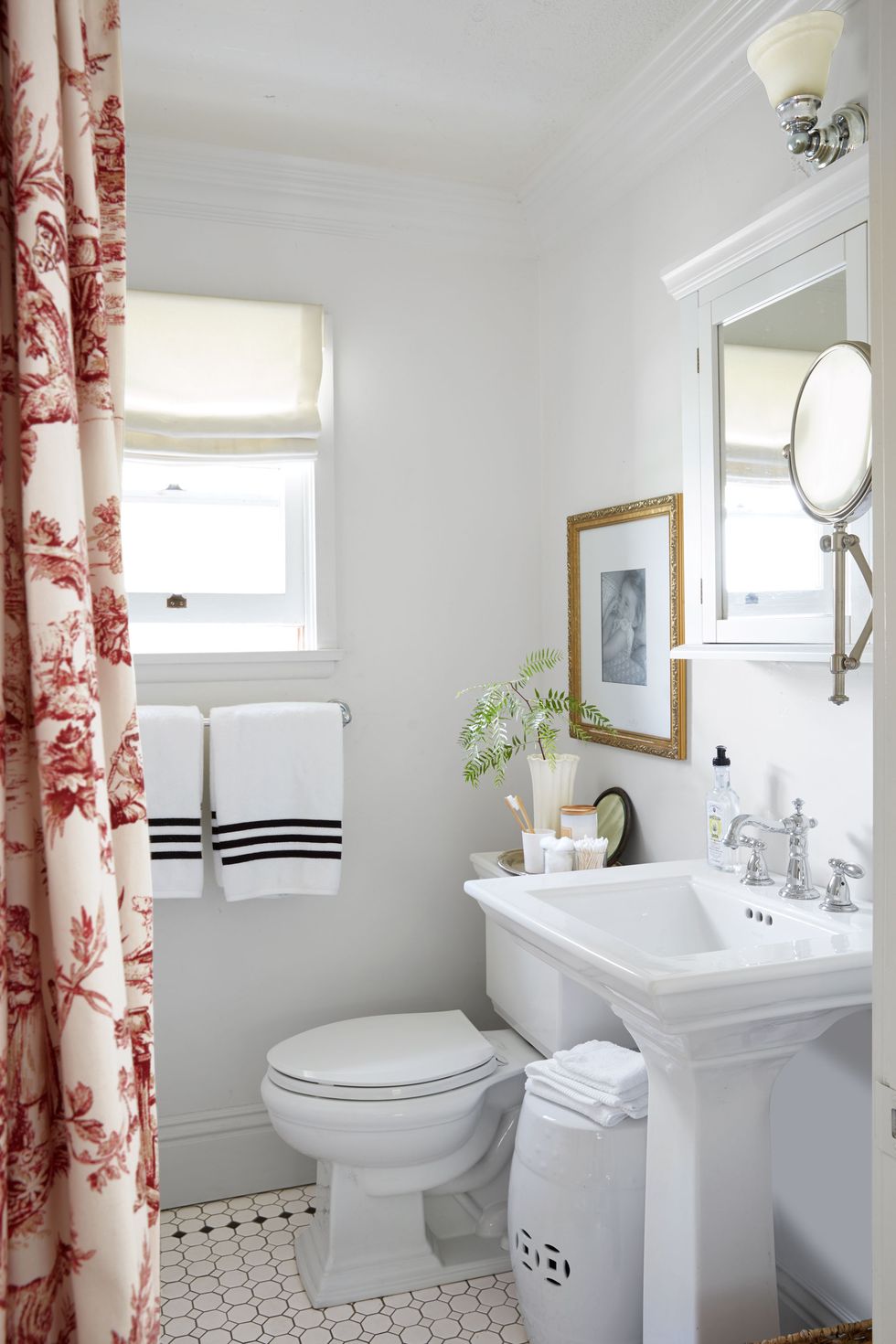 small white bathroom with toile curtain