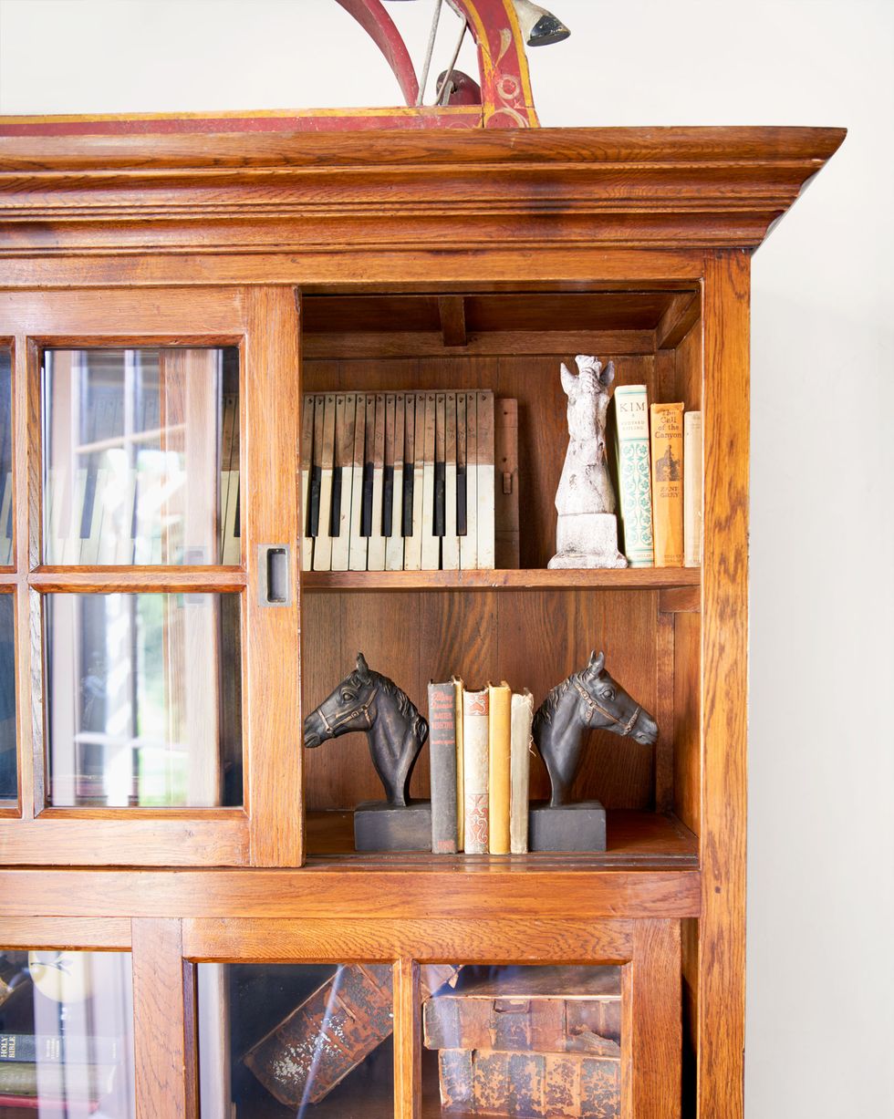 sheryl crow's collection of old books and equestrian items