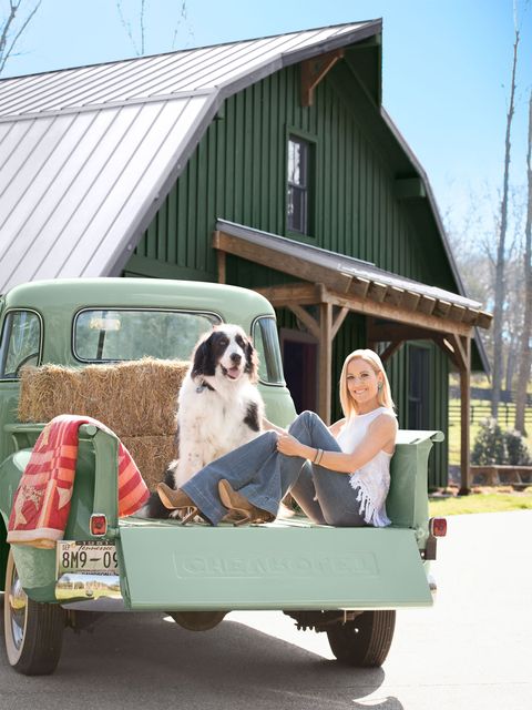 <p>Sheryl Crow (a CL subscriber and self-described junker!) sits in her mint green 1951 Chevy pickup truck with Benji outside the barn on her stunning Nashville property.</p>