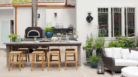 wood and stone kitchen area and seating in outdoor kitchen ideas