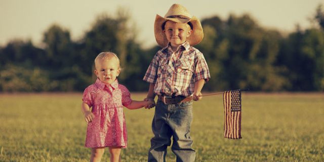 People, Hat, Child, People in nature, Toddler, Field, Rural area, Sun hat, Flag, Flag of the united states, 