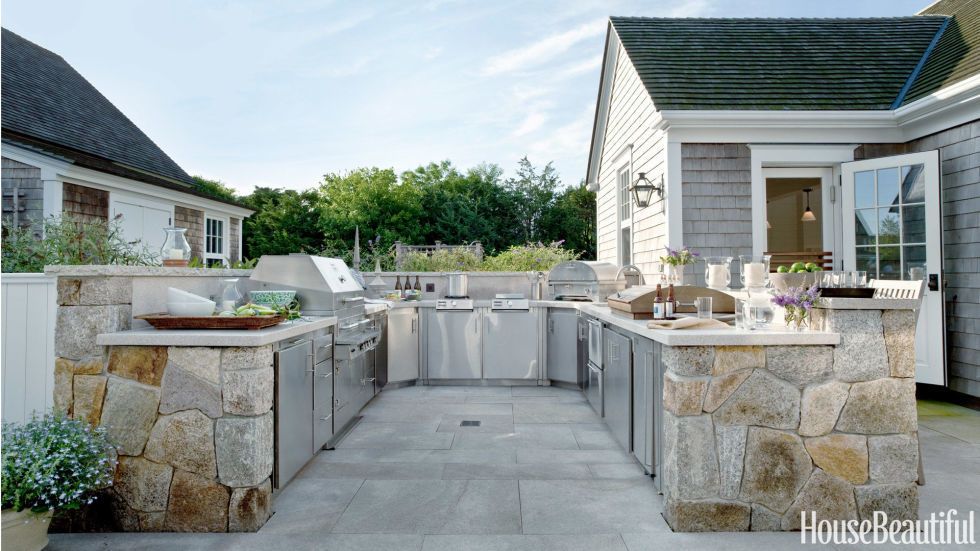 metal and stone backyard kitchen setup in outdoor kitchen ideas