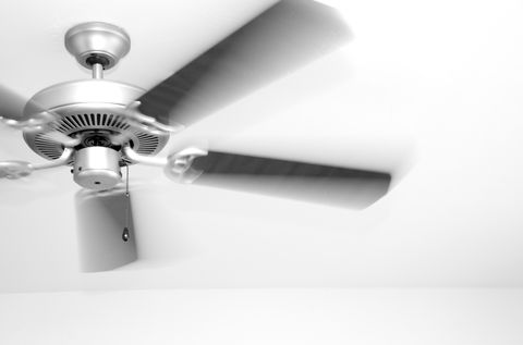 A ceiling fan in motion.