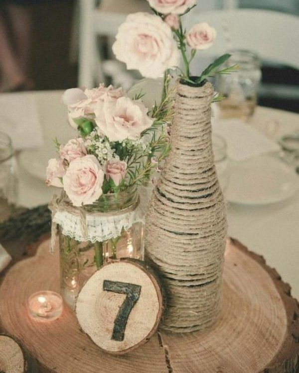 stump table adorned with lots of rustic wedding decor