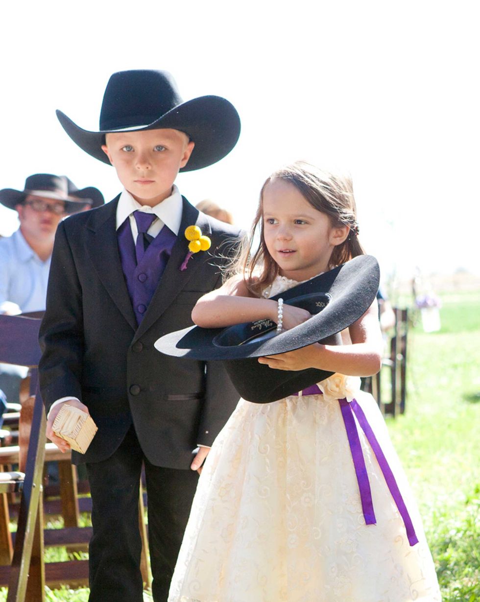 kids in cowboy hats at a wedding