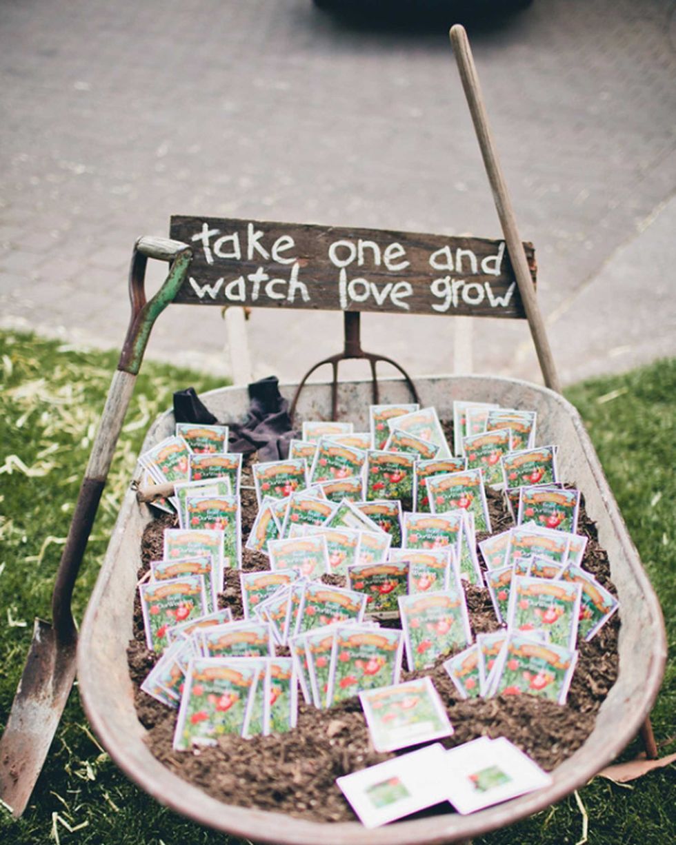 wheelbarrow filled with seed packet wedding favors