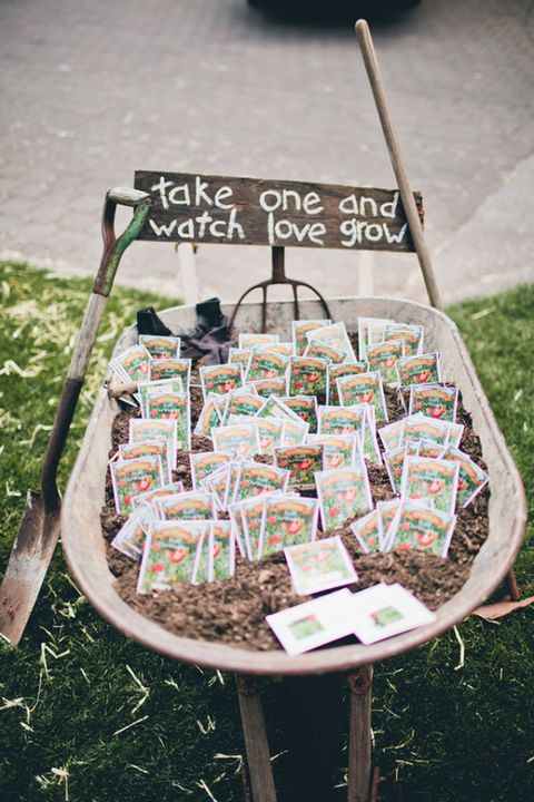 wheelbarrow filled with seed packet wedding favors