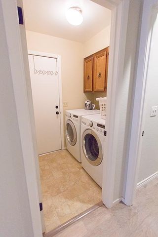 Washing machine, Property, Room, Floor, Laundry room, Clothes dryer, Major appliance, Wall, Flooring, Fixture, 