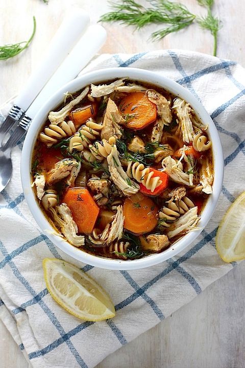 Steaming bowl of hearty winter soup with ingredients