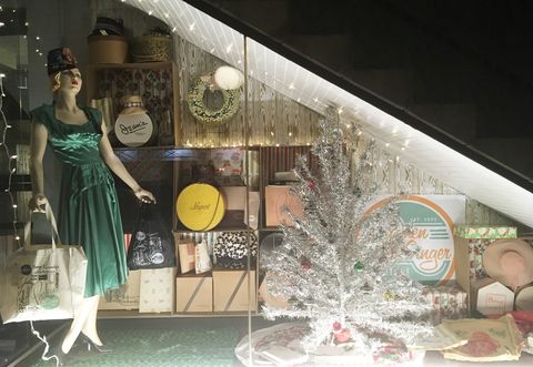 Dress, Christmas decoration, Mannequin, Display case, Retail, Holiday, Interior design, Display window, Christmas ornament, One-piece garment, 