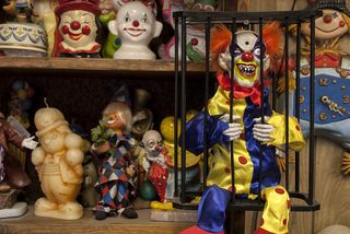Clown, Toy, Performing arts, Collection, Jester, Art, Fictional character, Souvenir, Action figure, 