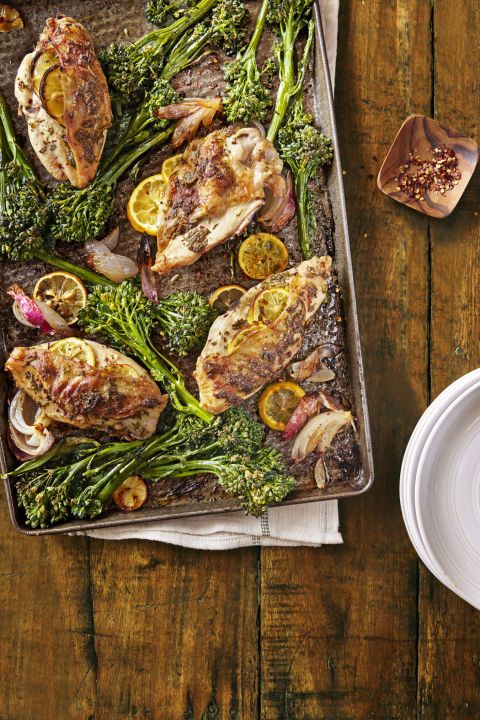 pan filled with lemon rosemary chicken with roasted broccolini