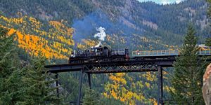 Transport, Mountainous landforms, Tree, Rolling stock, Highland, Mountain range, Mountain, Valley, Hill station, Forest, 