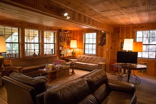 Wood, Lighting, Room, Interior design, Brown, Window, Hardwood, Living room, Floor, Couch, 