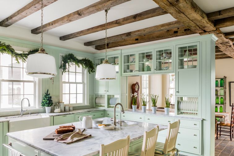 farmhouse kitchen with light green cabinets