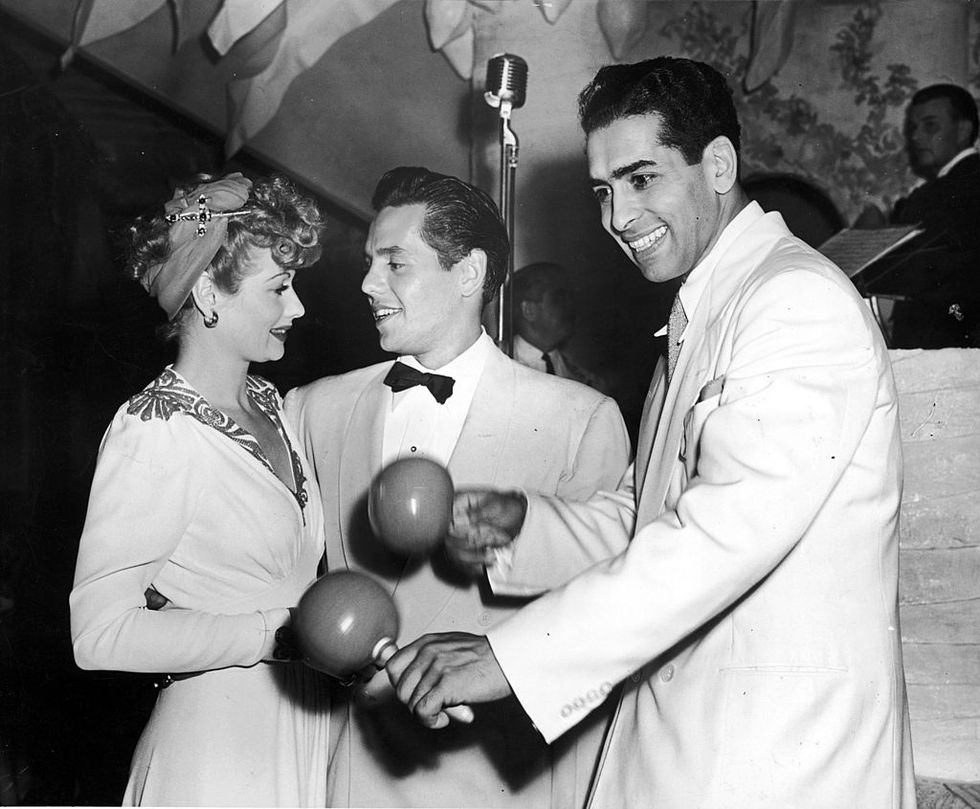 Lucy and Desi with Darryl Harpa, bandleader of New York's Copacabana nightclub, circa 1941.