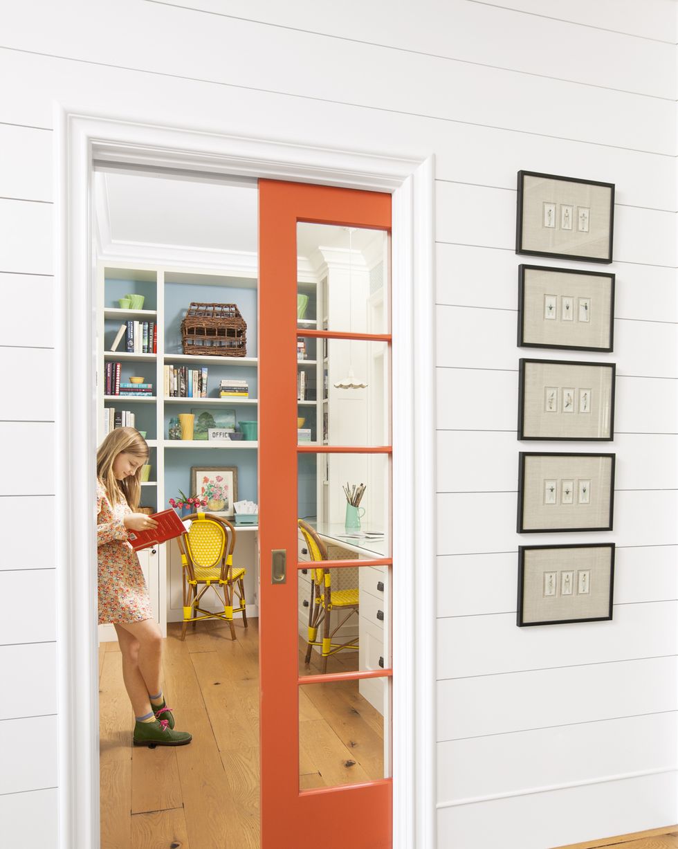 home office with orange pocket door