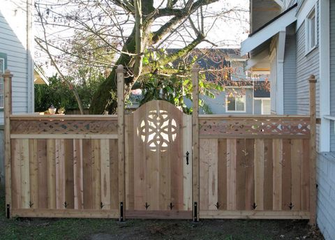 Fence, Home fencing, Backyard, Wood, Gate, Yard, Hardwood, Tree, Outdoor structure, Architecture, 